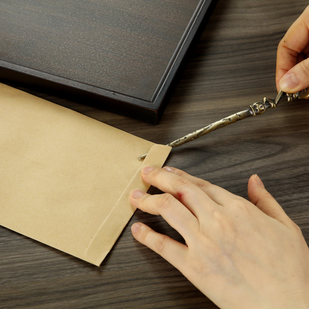 Ouvre-lettres en alliage de zinc en forme de baguette magique, mini couteau utilitaire portable, ouvre-enveloppes, couteau à courrier, fournitures scolaires et de bureau, 1 pièce.